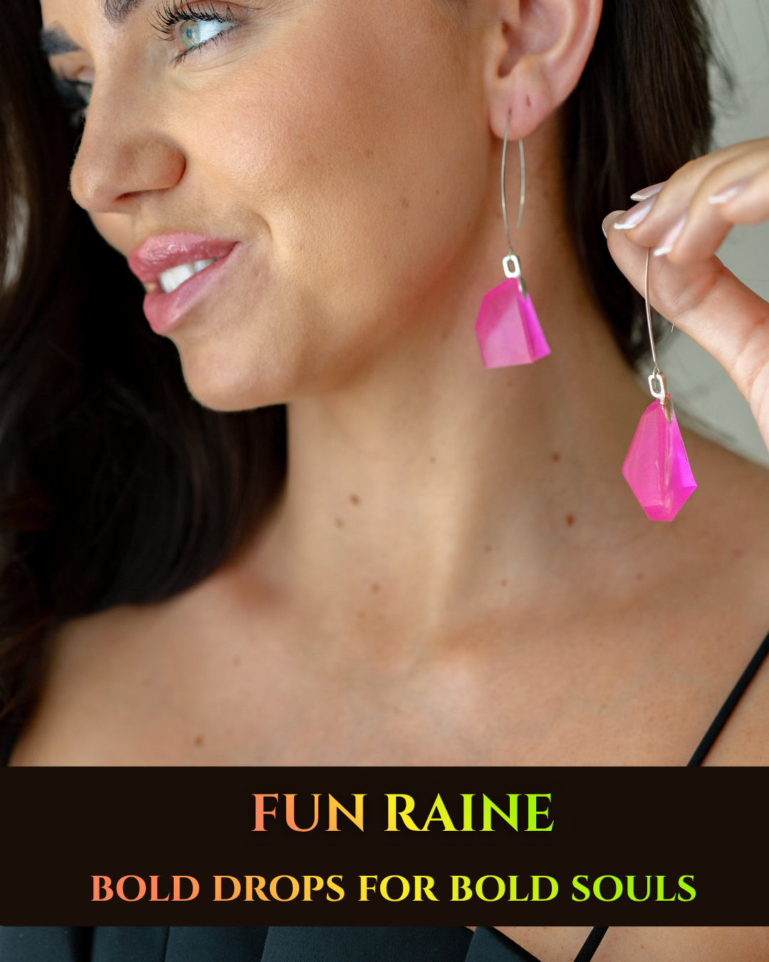 Woman wearing pink drop earrings.